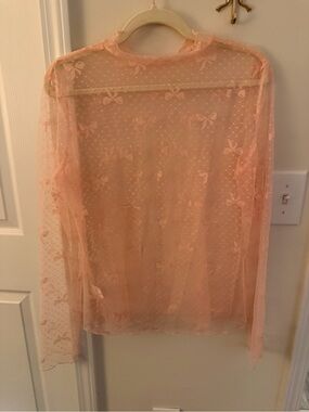 Light pink mesh bow print mock neck
